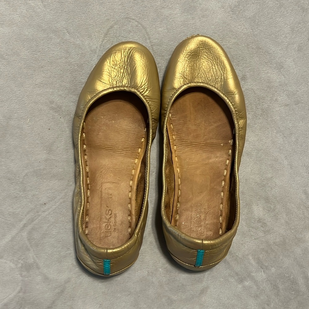 Metallic gold Tieks size 11